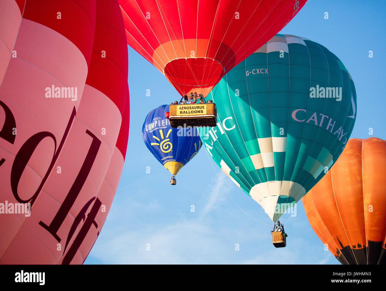 Bristol, UK. 13th August, 2017. Some of the 130 plus balloons launched at dawn from Ashton Court park in Bristol on the final day of the 39th Bristol International Balloon Fiesta Credit: Steve Taylor ARPS/Alamy Live News Stock Photo