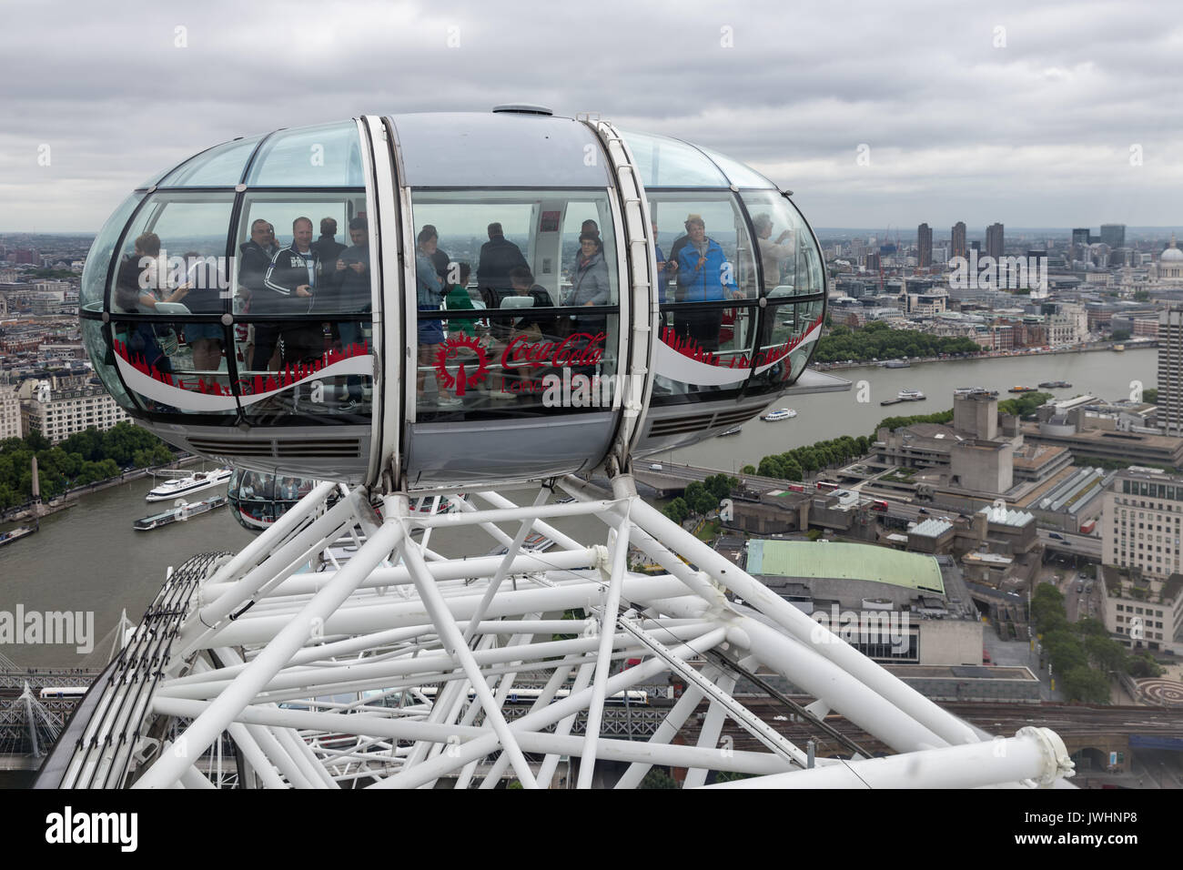 LONDON, ENGLAND - JUNE 08, 2017: Tourists in cabin London Eye with aerial view at London, England Stock Photo