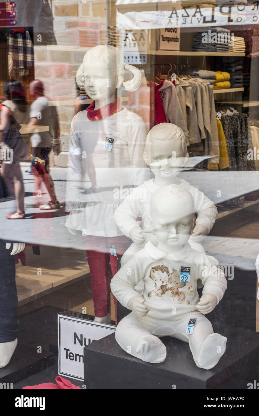 Showcase clothing store, reflection on the street Stock Photo Alamy