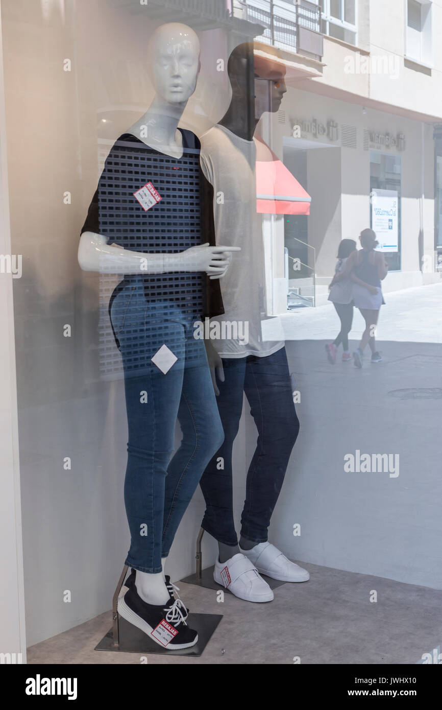 Showcase clothing store, reflection on the street Stock Photo Alamy