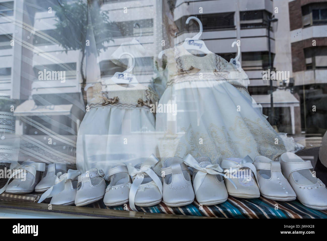 Showcase clothing store children, reflection on the street Stock Photo