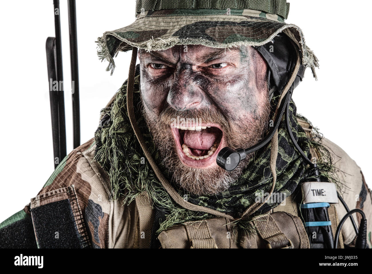 United States Commando face studio shot. Mouth opened, soldier yelling, emitting intiminate formidable frightening scream. Closeup portrait, cropped,  Stock Photo