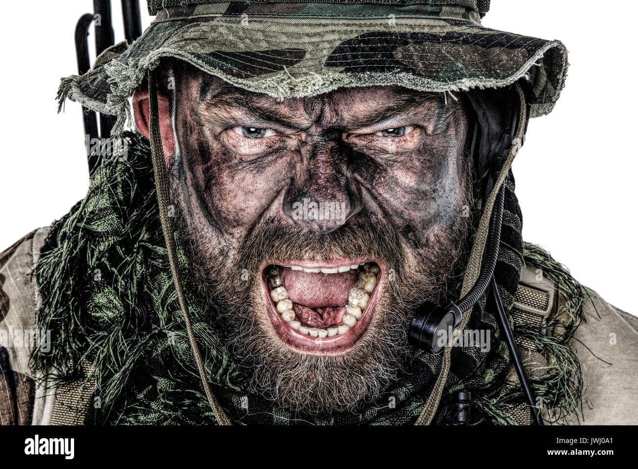 United States Commando face studio shot. Mouth opened, soldier yelling, emitting intimidate formidable frightening scream. Closeup portrait, cropped,  Stock Photo