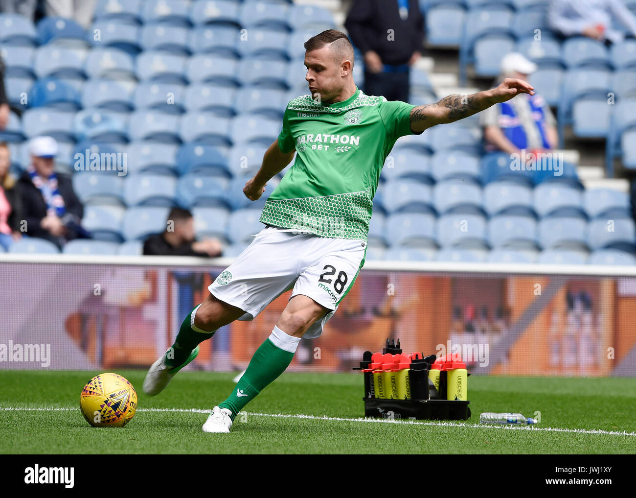 Hibs Anthony Stokes during the warm up before the Ladbrokes Scottish Premiership match at the Ibrox Stadium, Glasgow. Stock Photo