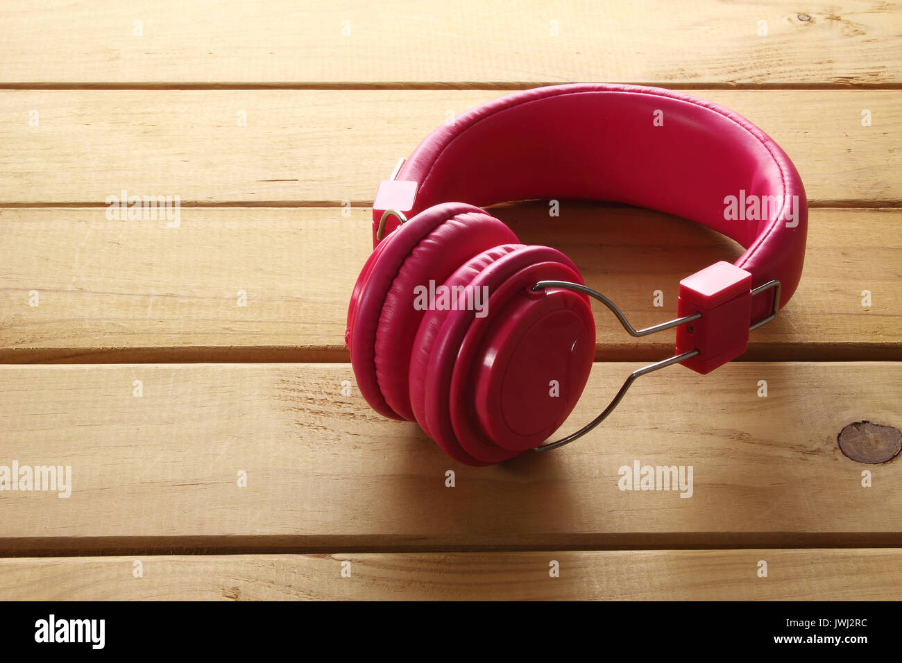 Headphone on Wooden Background Stock Photo