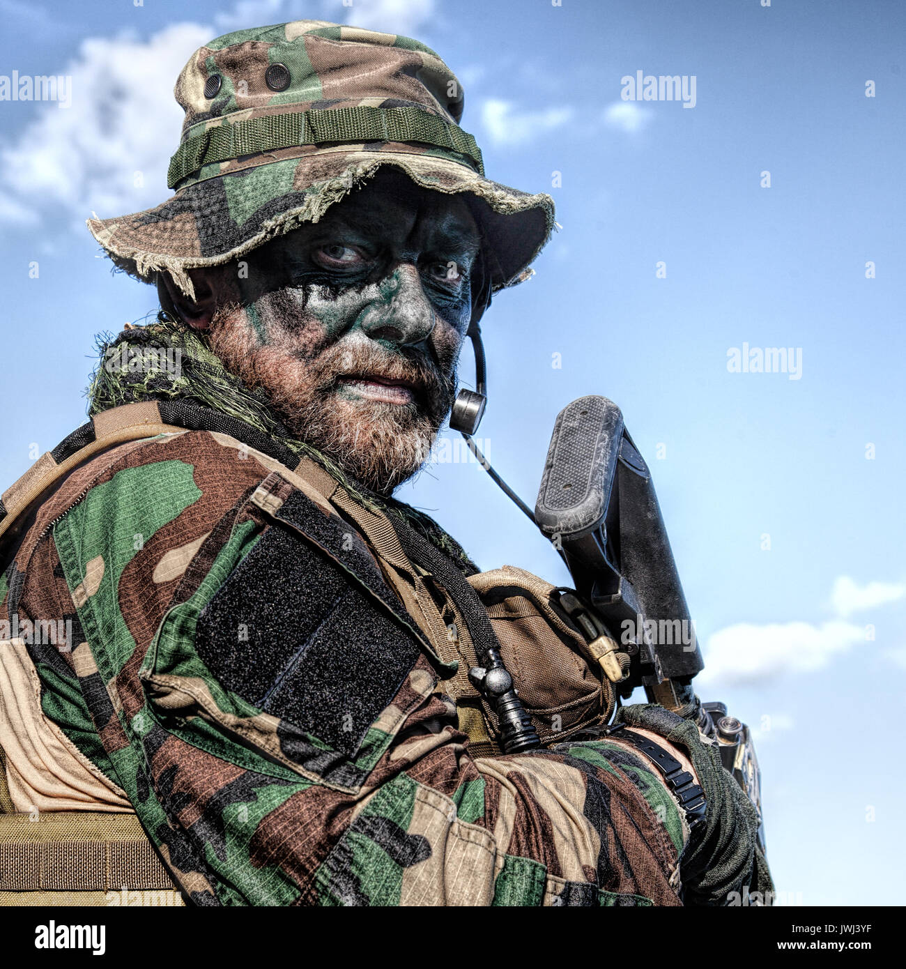 Bearded soldier of special forces on blue sky background Stock Photo - Alamy