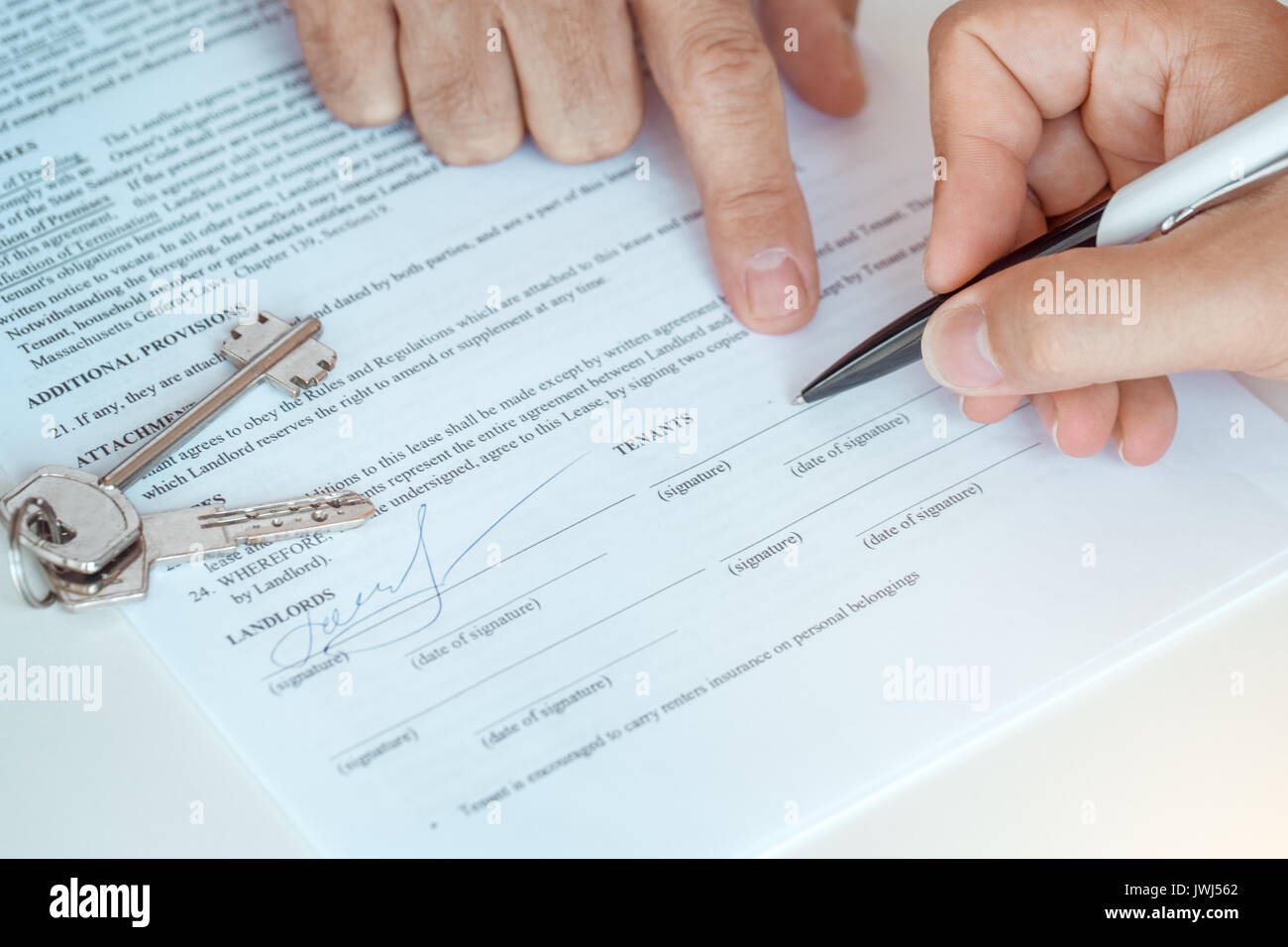 Trade For Rent Real Man with real estate agent rent apartment signing contract Stock Photo ...