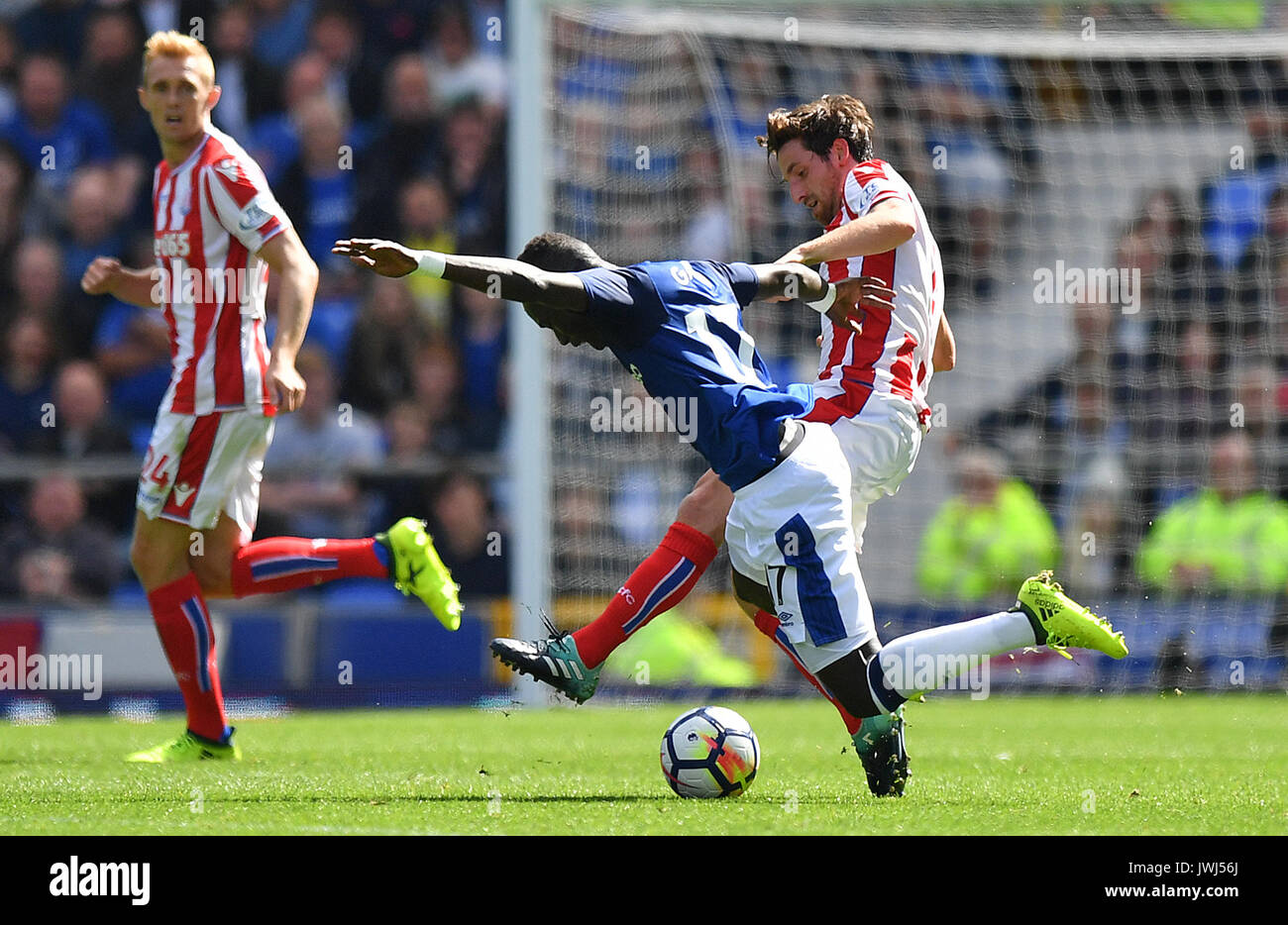 Everton's Idrissa Gueye and Stoke City's Joe Allen (right) battle for the ball during the Premier League match at Goodison Park, Liverpool. Stock Photo