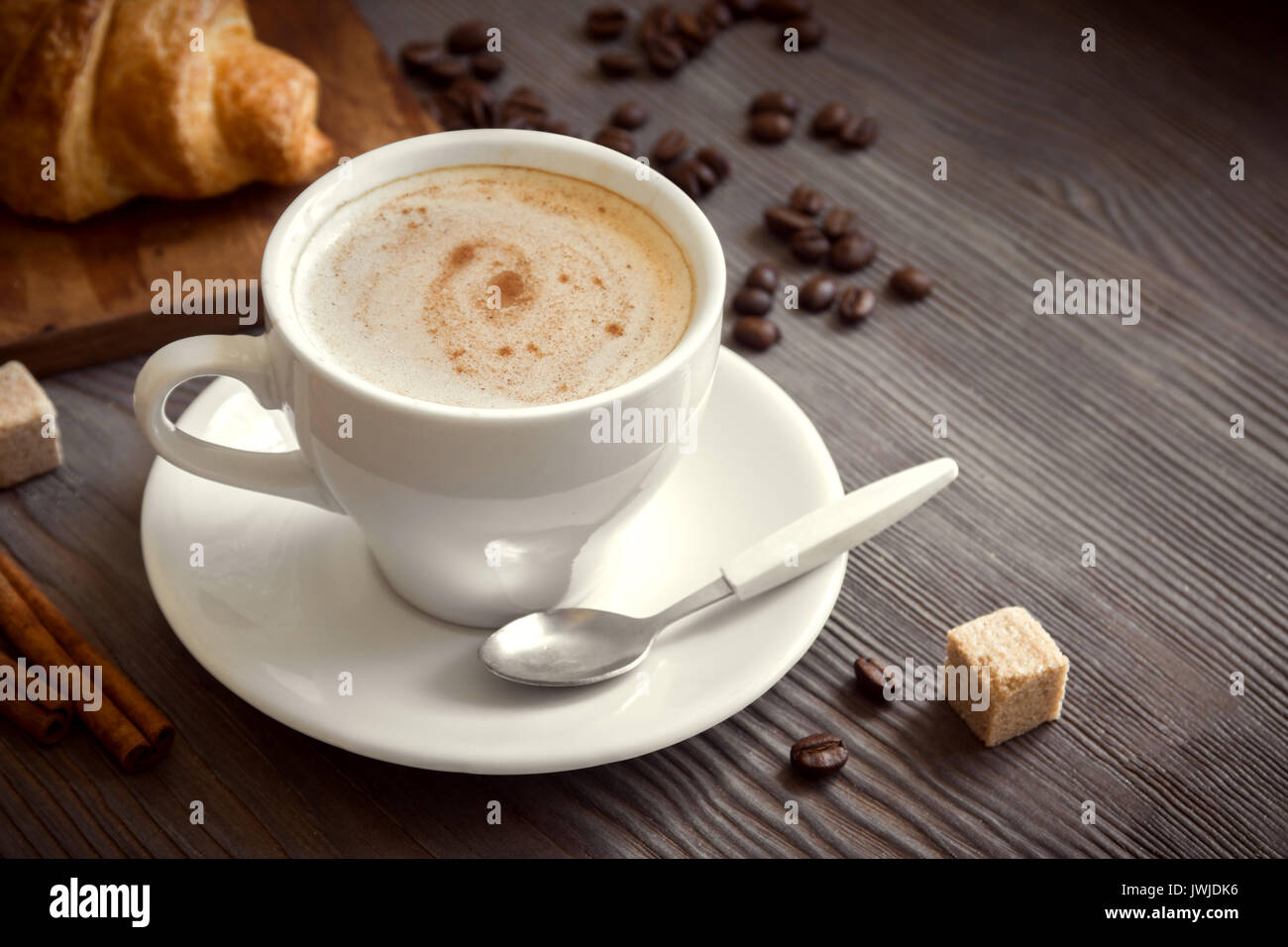 Coffee with croissant for breakfast. Cappuccino coffee and french ...