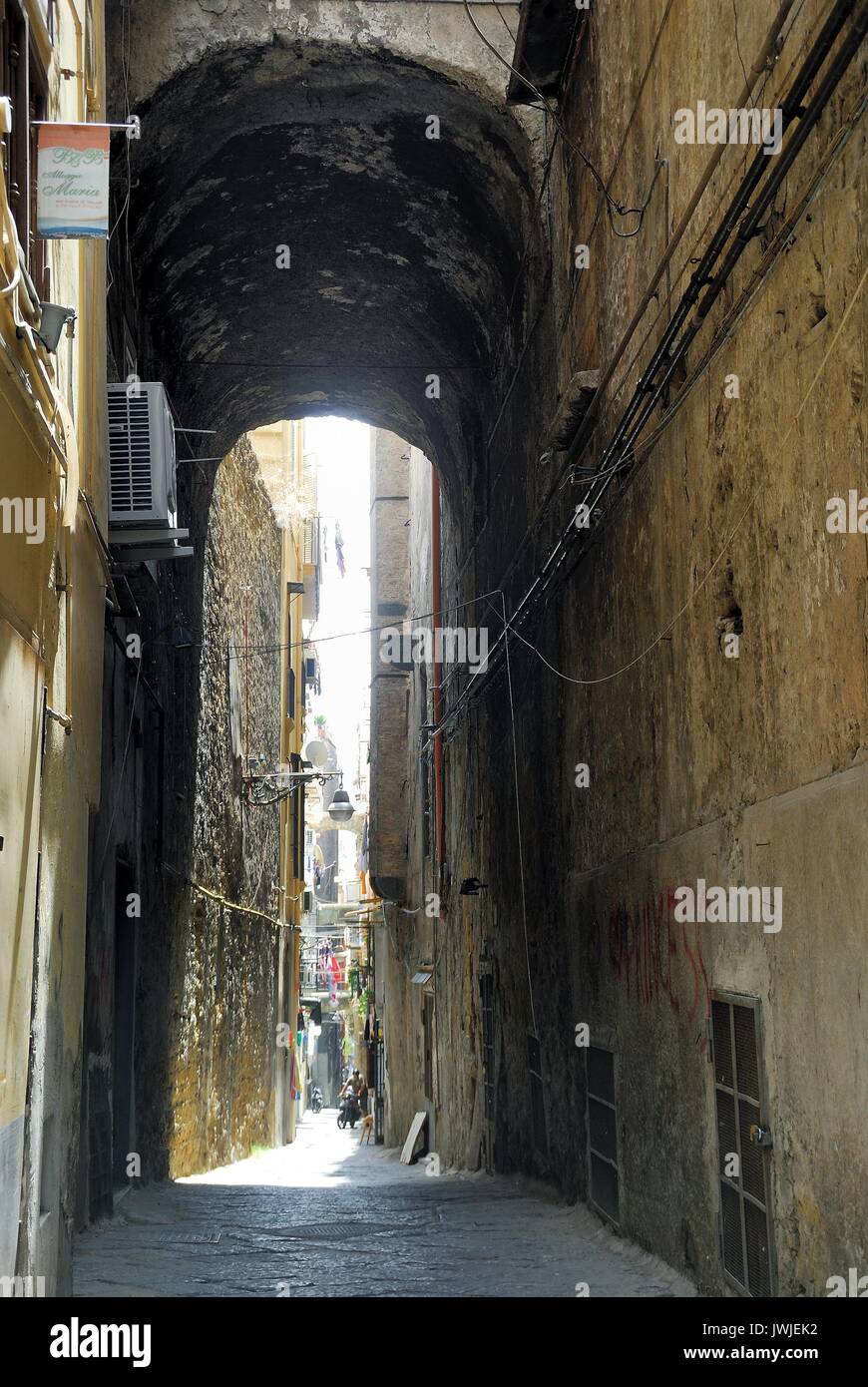 Naples historic center. A narrow alley along Via San Biagio dei Librai. Stock Photo