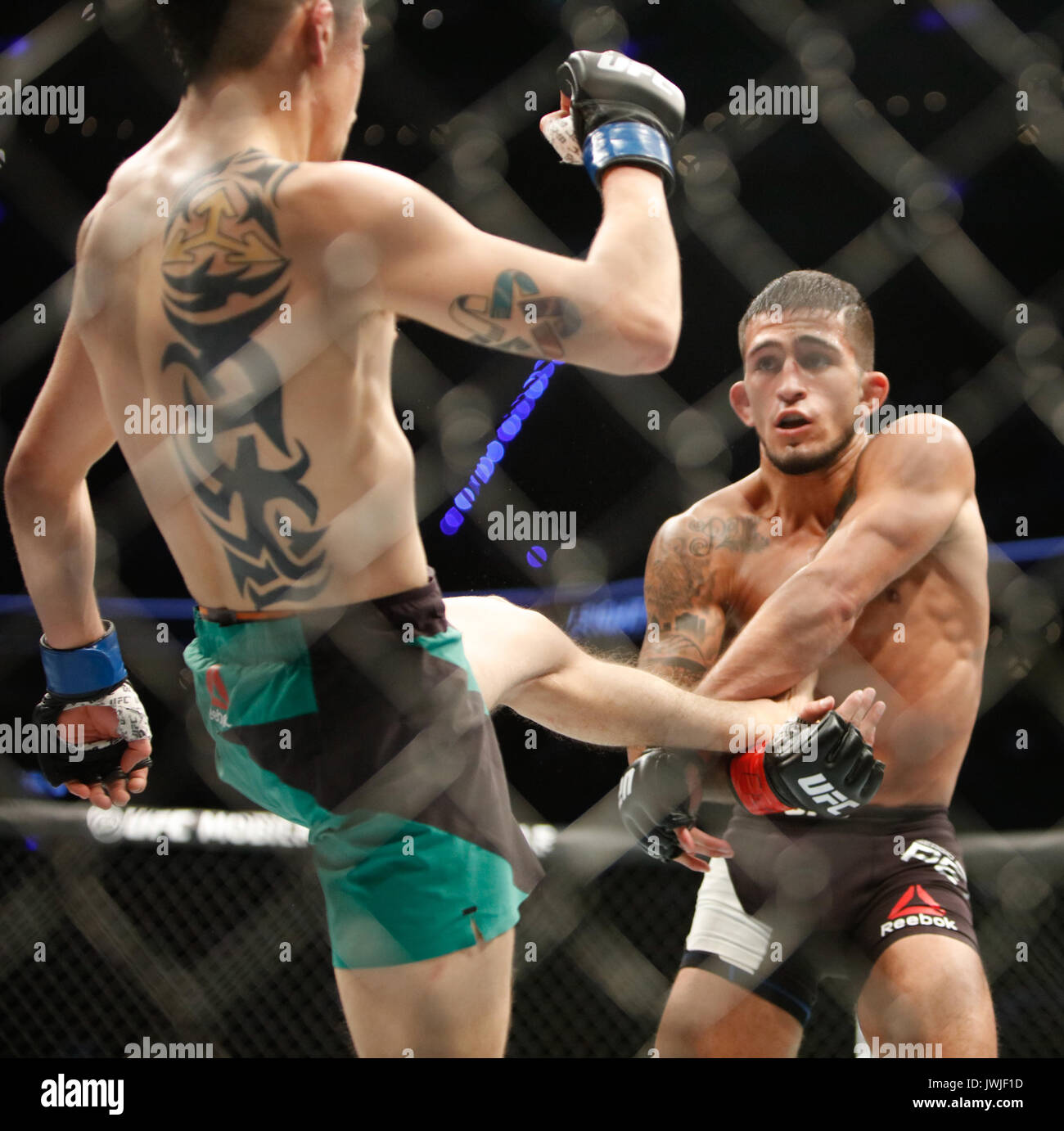 Brandon Moreno takes Sergio Pettis during UFC Fight Night 114 Mexico City,Mexico Stock Photo
