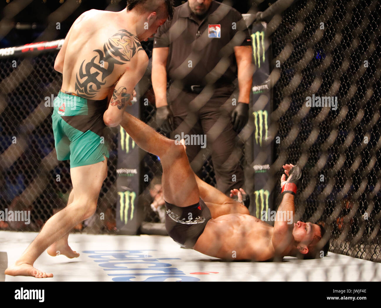Brandon Moreno takes Sergio Pettis during UFC Fight Night 114 Mexico City,Mexico Stock Photo