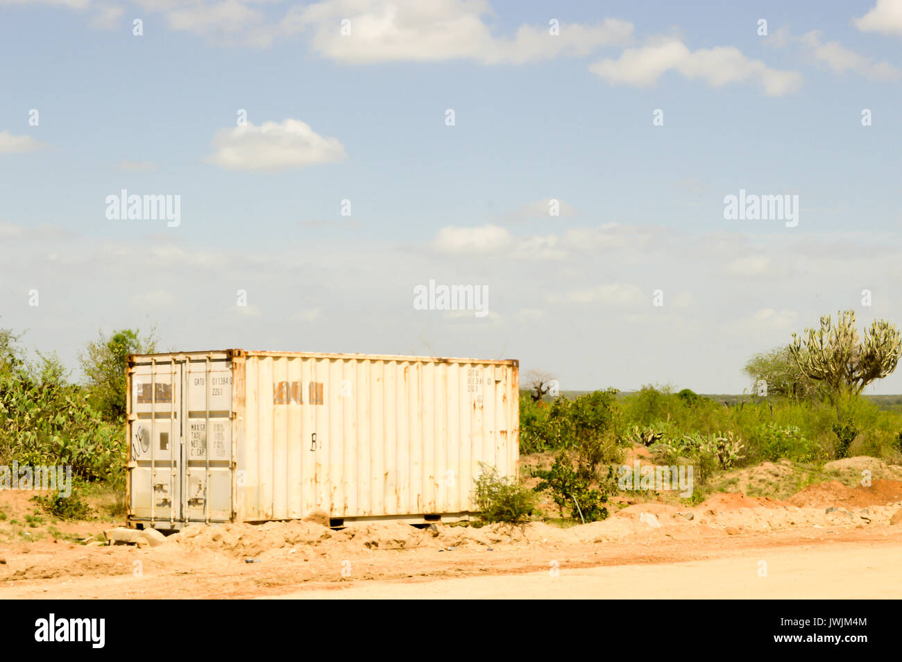 White metal containers located along a road in Kenya Stock Photo