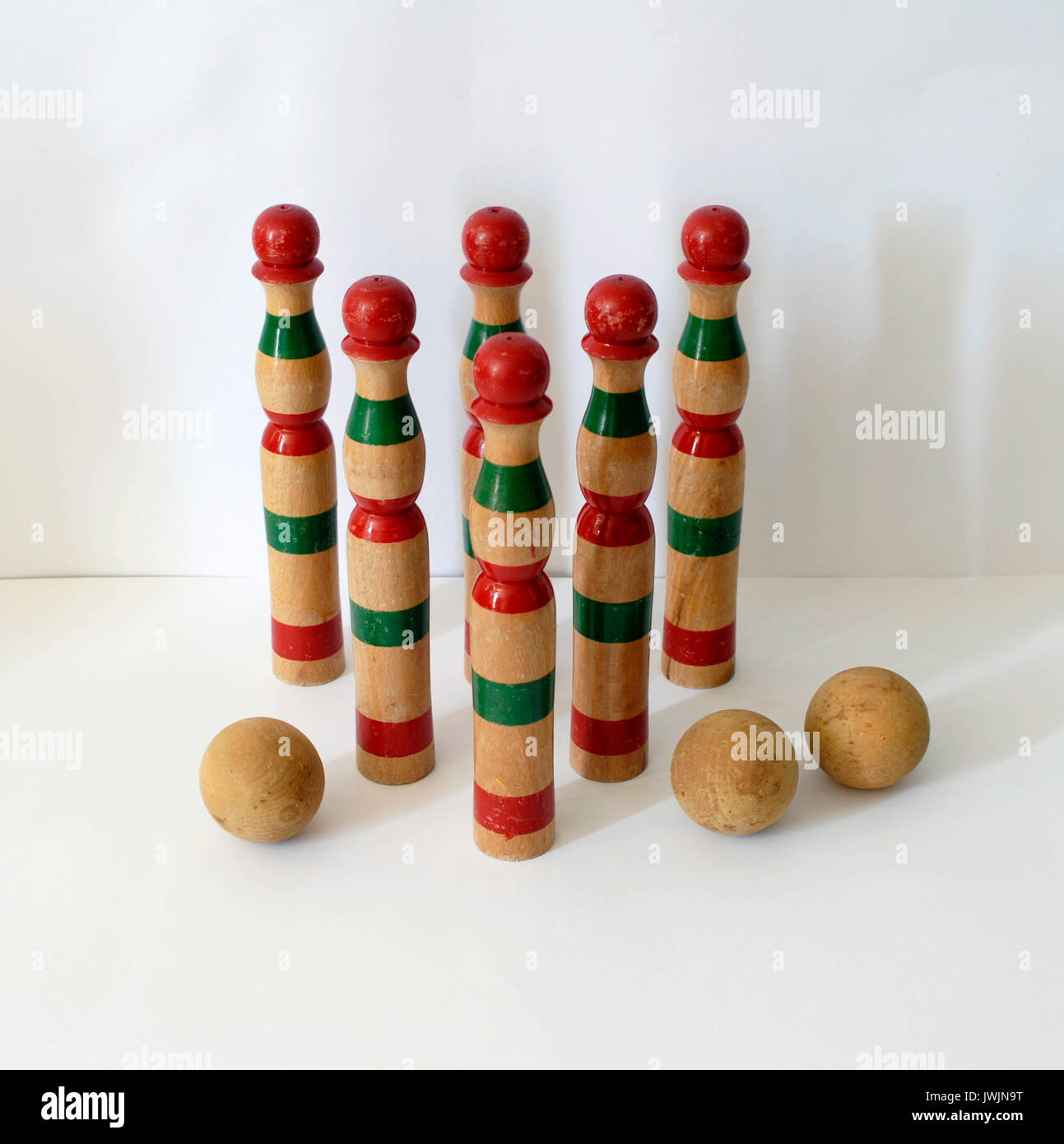 Vintage wooden bowling kit game, with balls. Made in Spain, with colors green and red Stock Photo