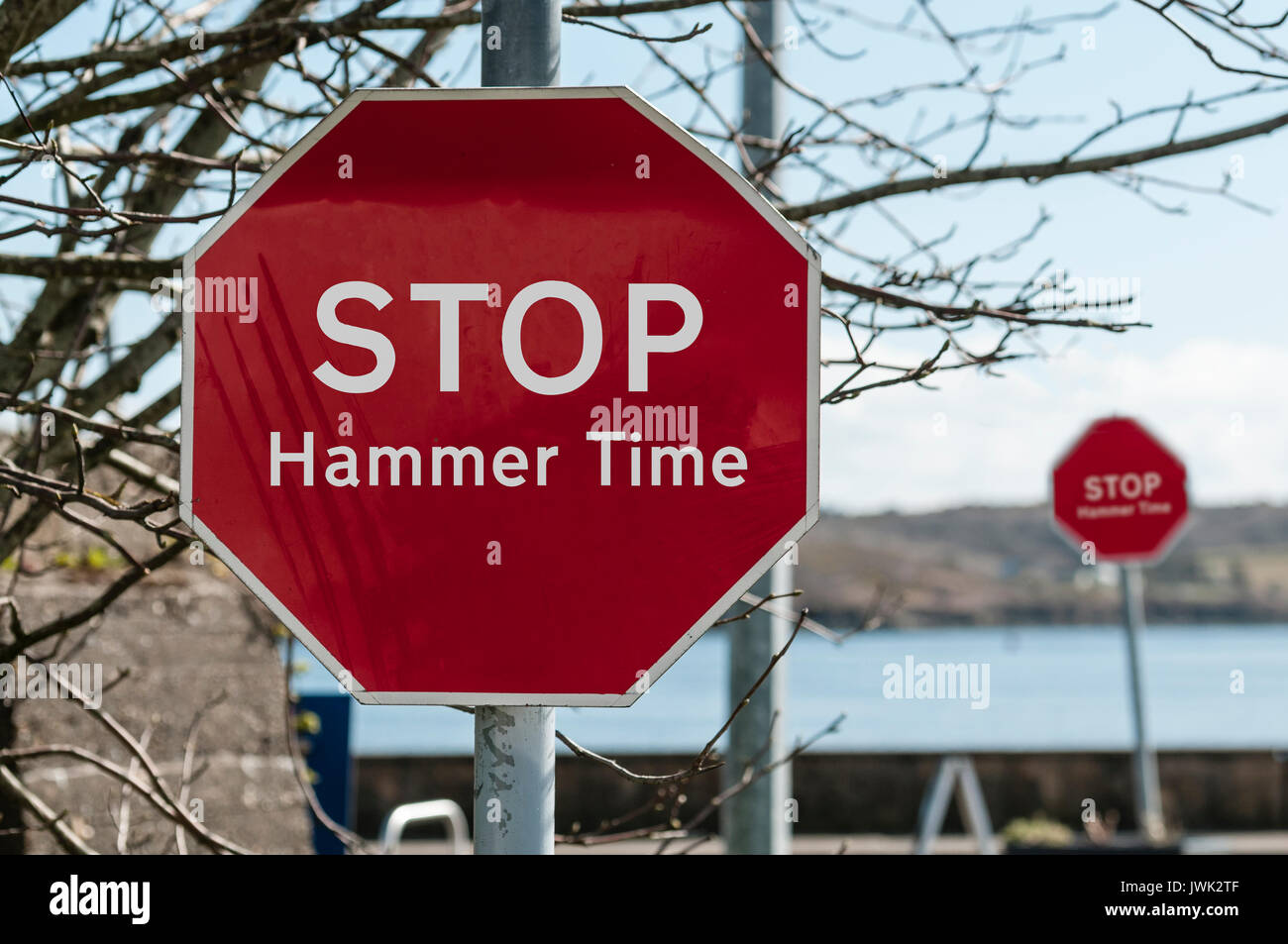Sign at a stop junction in Ireland saying 'Stop Hammer Time' Stock Photo