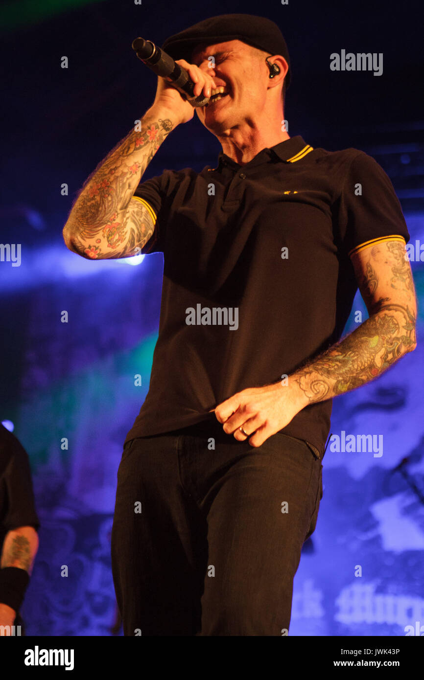 Singer Al Barr is shown performing onstage during a live concert  appearance with the Dropkick Murphys Stock Photo - Alamy