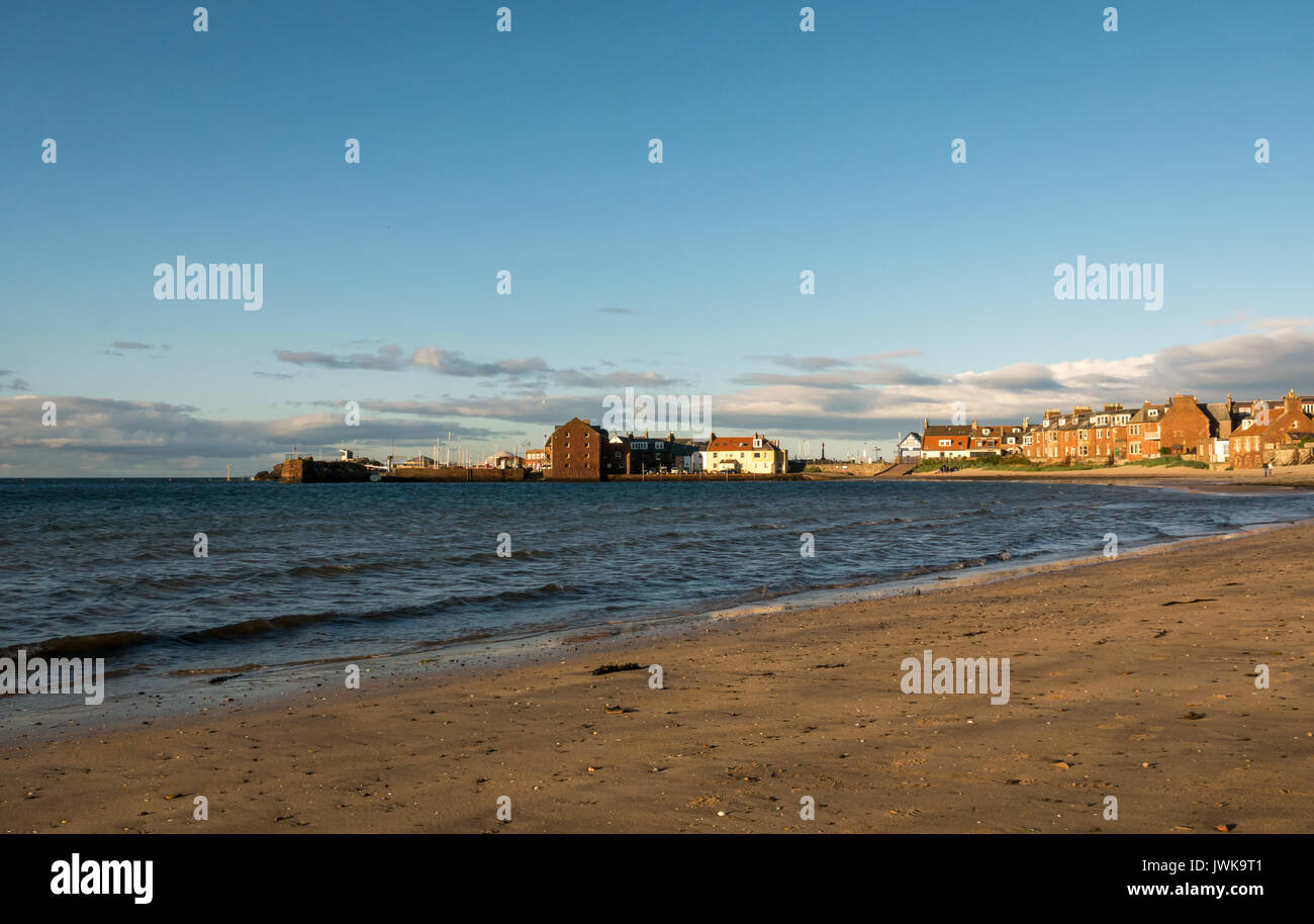 View across West Bay of North Berwick harbour, East Lothian, Scotland, UK, in evening light with blue sky Stock Photo