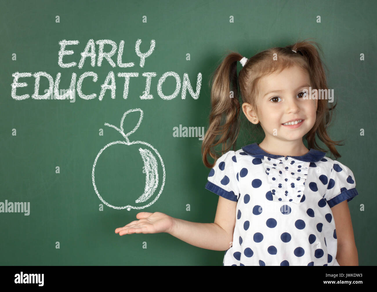 early education concept, child near school blackboard Stock Photo