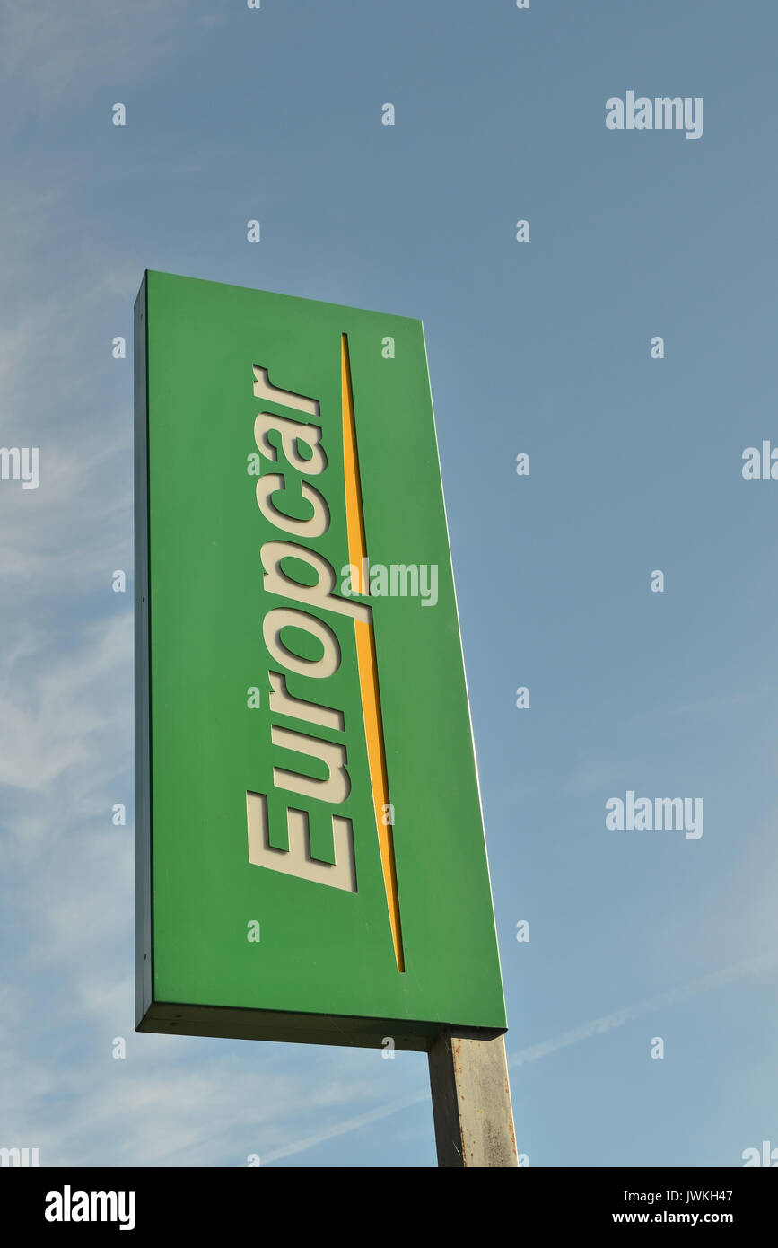 Europcar sign with blue sky background Stock Photo