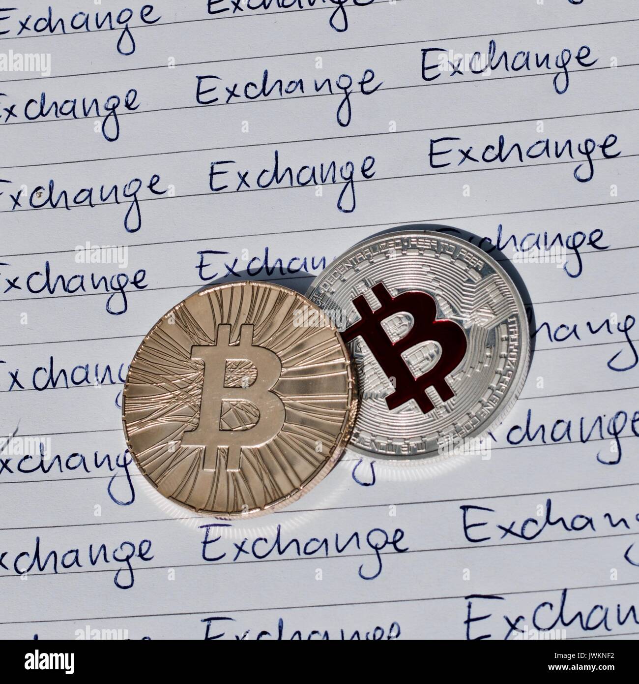 Digital currency physical metal bitcoin coin on the notebook with ...