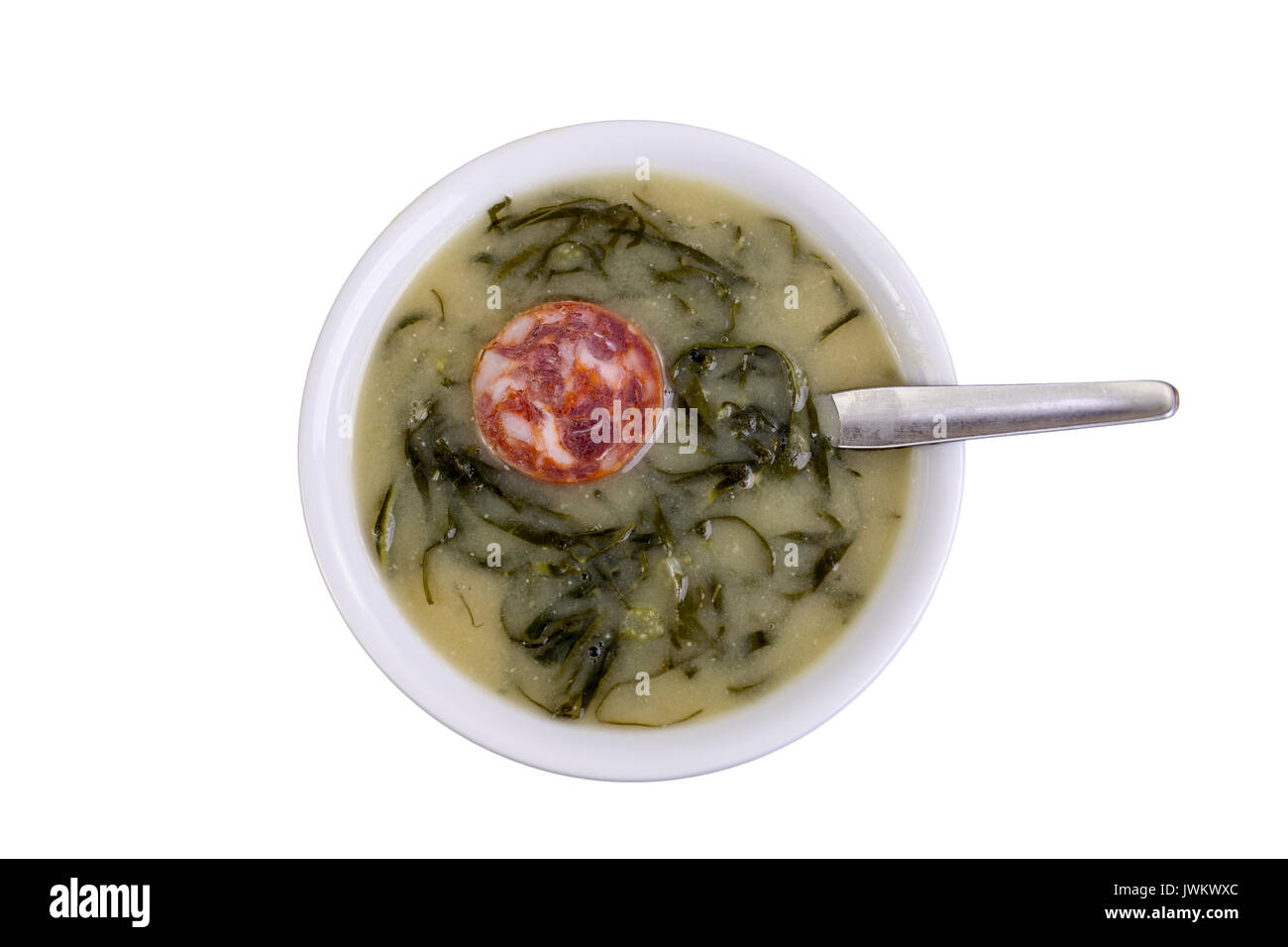 Green broth, called Caldo Verde, is a very popular soup in Portuguese cuisine with potatoes, thinly sliced collard greens, olive oil, salt and slices  Stock Photo