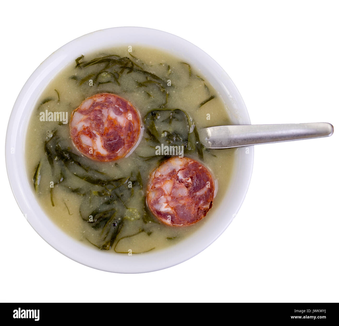 Green broth, called Caldo Verde, is a very popular soup in Portuguese cuisine with potatoes, thinly sliced collard greens, olive oil, salt and slices  Stock Photo