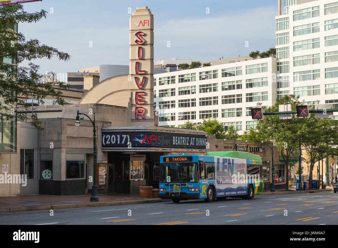 An MCDOT Ride On bus passes the AFI Silver Theatre and Cultural Center in Silver Spring, Maryland. Stock Photo