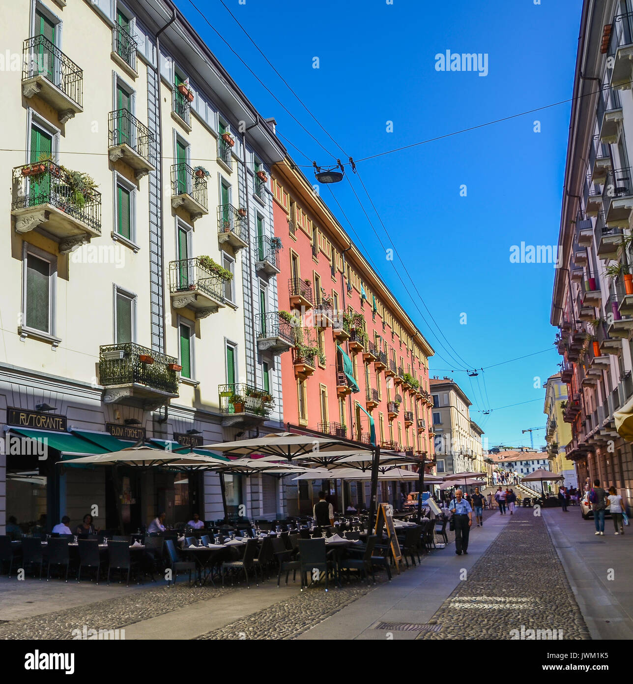 Milan, Italy street with cafes and restaurant on a sunny day Stock Photo