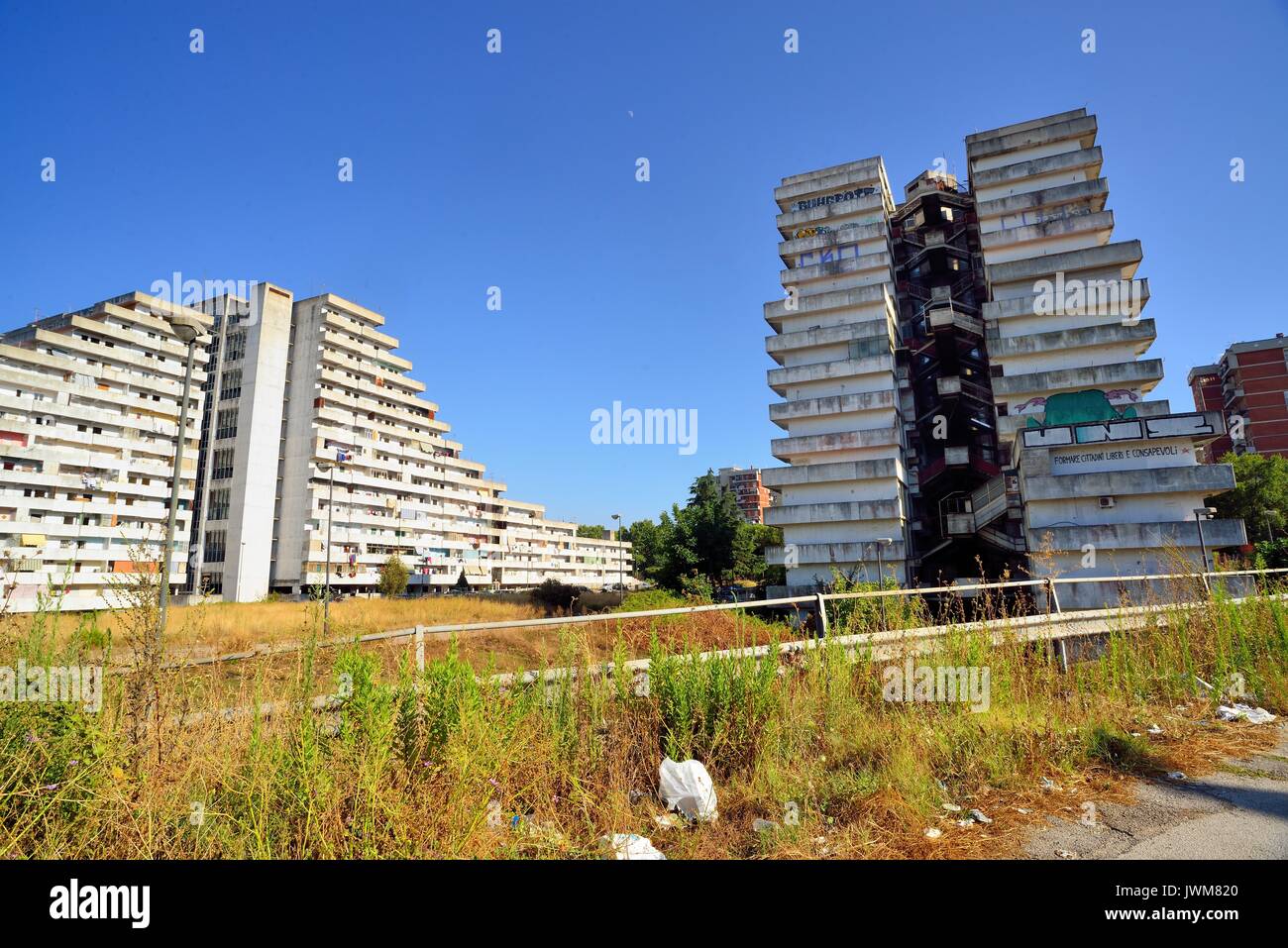 Naples, Italy. Scampia Vele are residential buildings built in the homonymous district of Naples between 1962 and 1975. The movie Gomorrah by Matteo Garrone was shot at the Vele, it has showin to the public the urban and human degradation of the neighborhood. Scampia is an important drug dealing center. Stock Photo