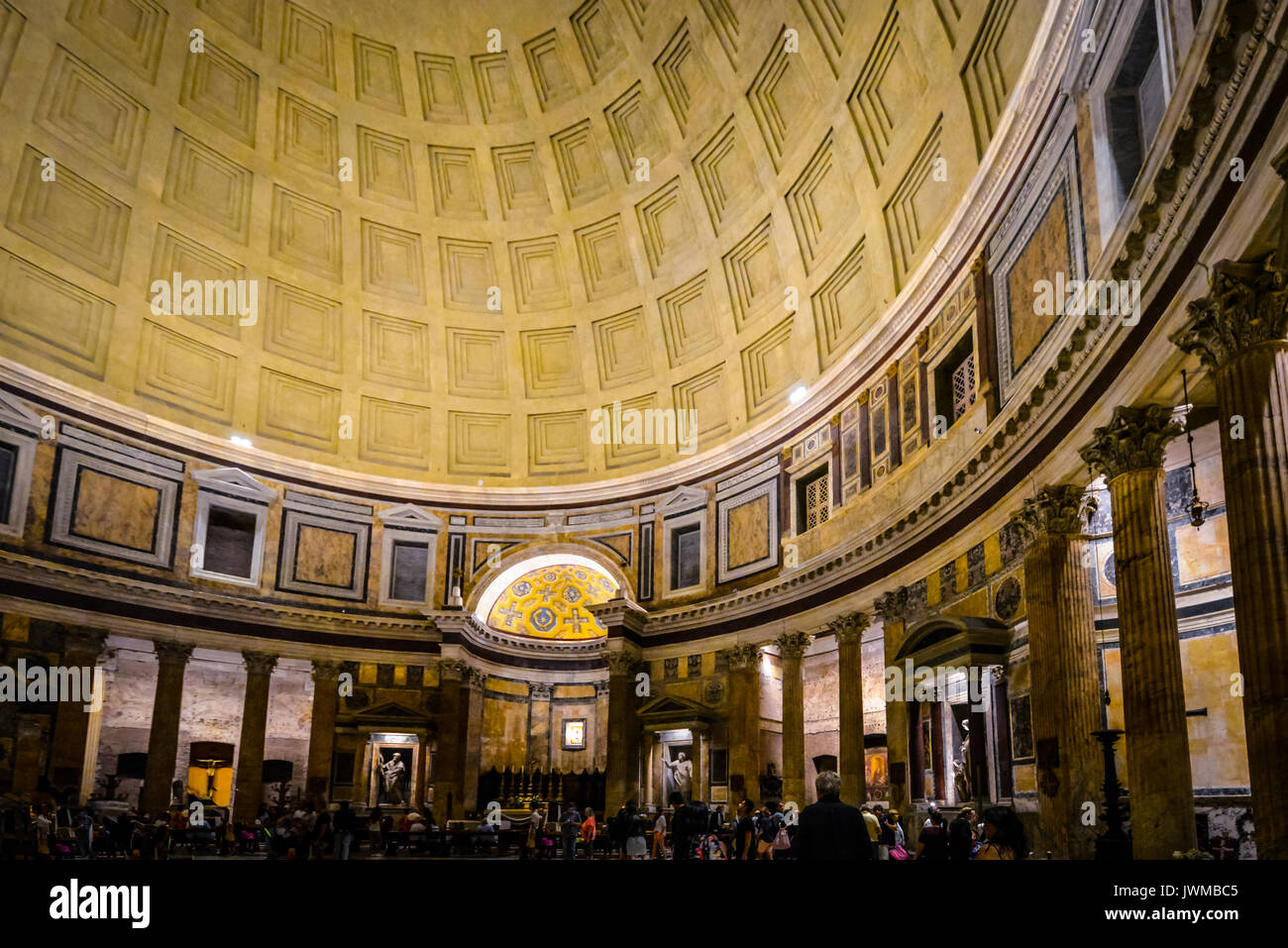 Interior of the ancient Pantheon including the dome, columns and marble statues in Rome Italy at night Stock Photo