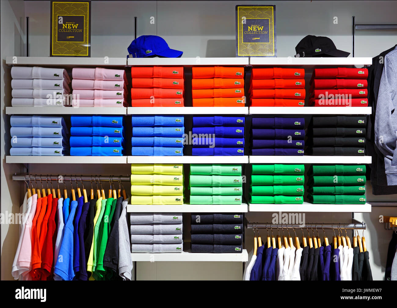 Piles of colorful Lacoste polo shirts shelves. Lacoste is French clothing company famous for its tennis shirts Stock Photo - Alamy