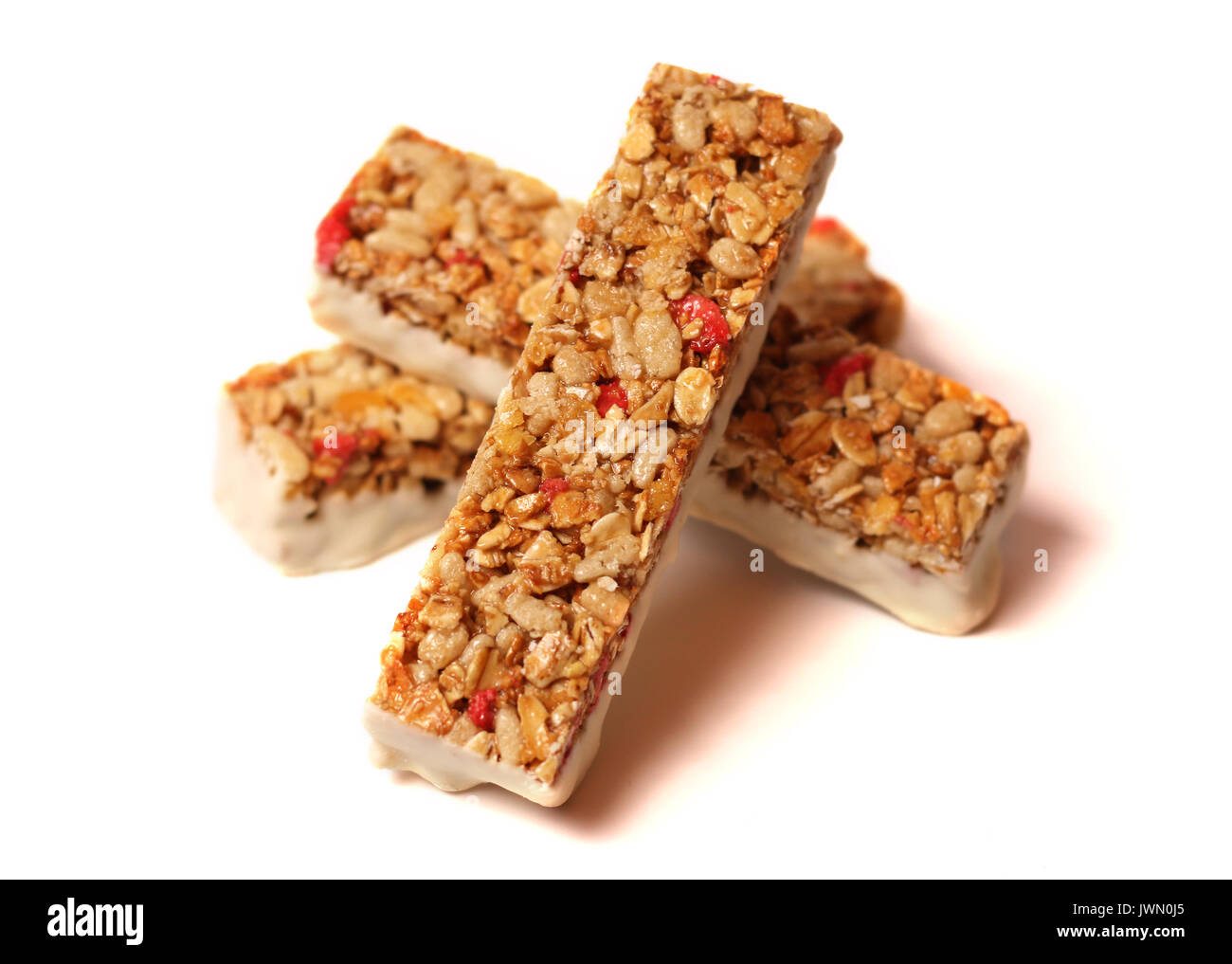 Three fruit and yogurt granola bars on a white background Stock Photo