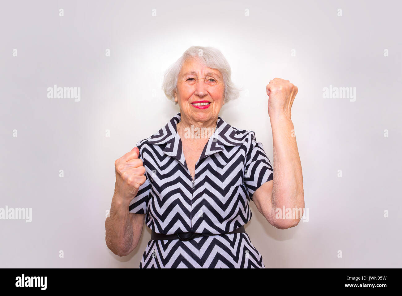 Old woman celebrating a win hi-res stock photography and images - Alamy
