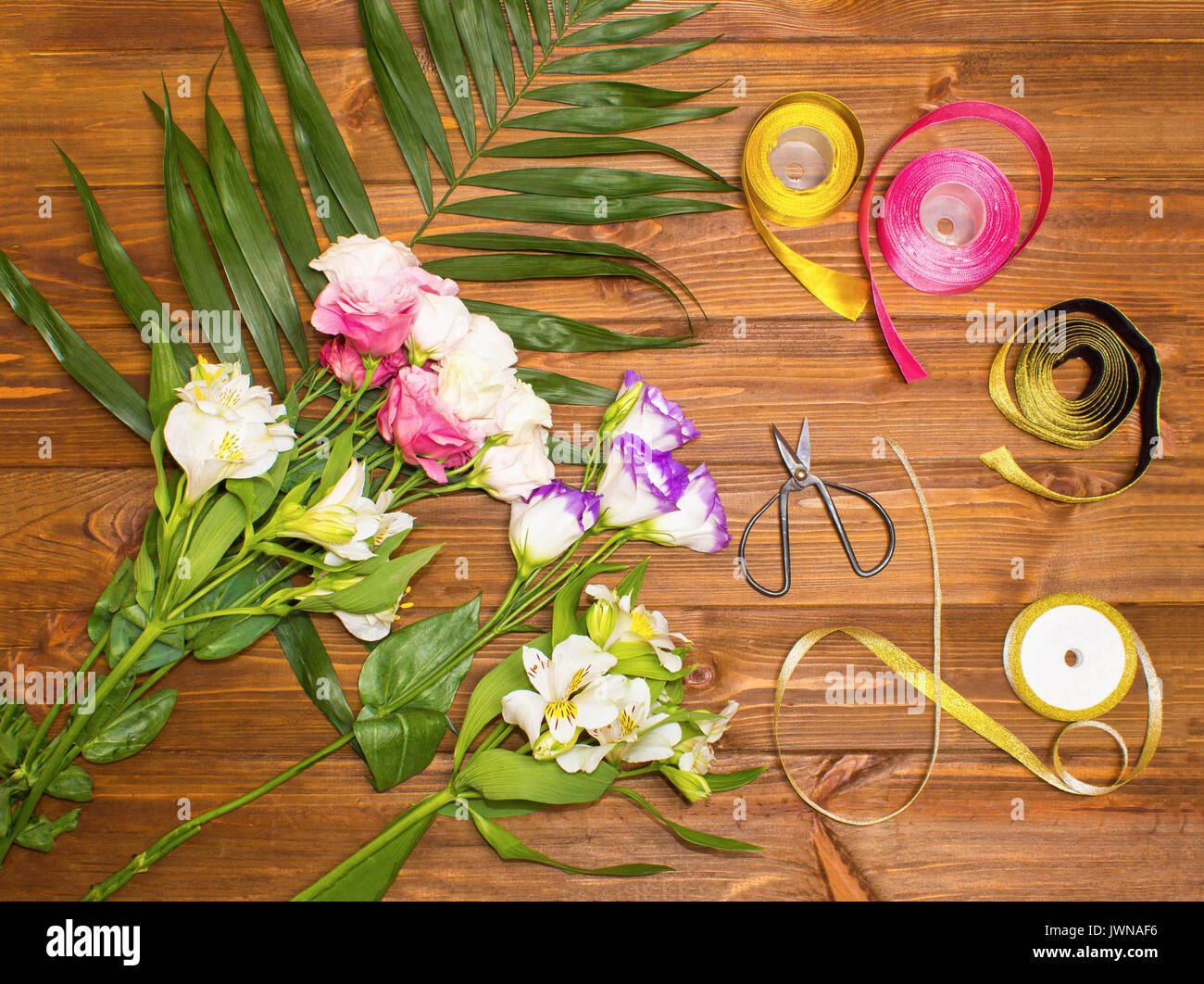 The florist desktop with working tools on wooden background Stock Photo