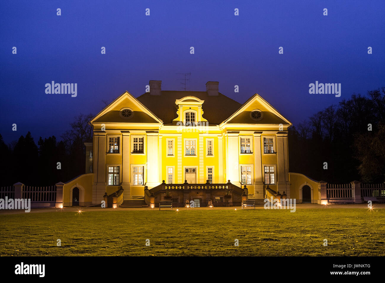 Night illuminated view of Palmse manor, Estonia. Luxury villa, park and information center. Stock Photo