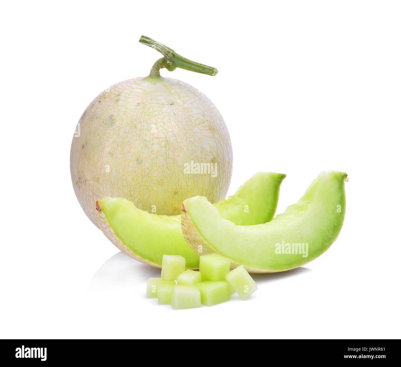 green cantaloupe melon with slice and cubes isolated on white ...