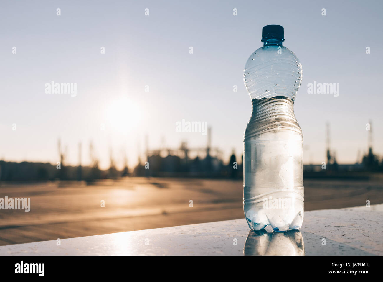 Plastic bottle of cold mineral water outdoors Stock Photo - Alamy