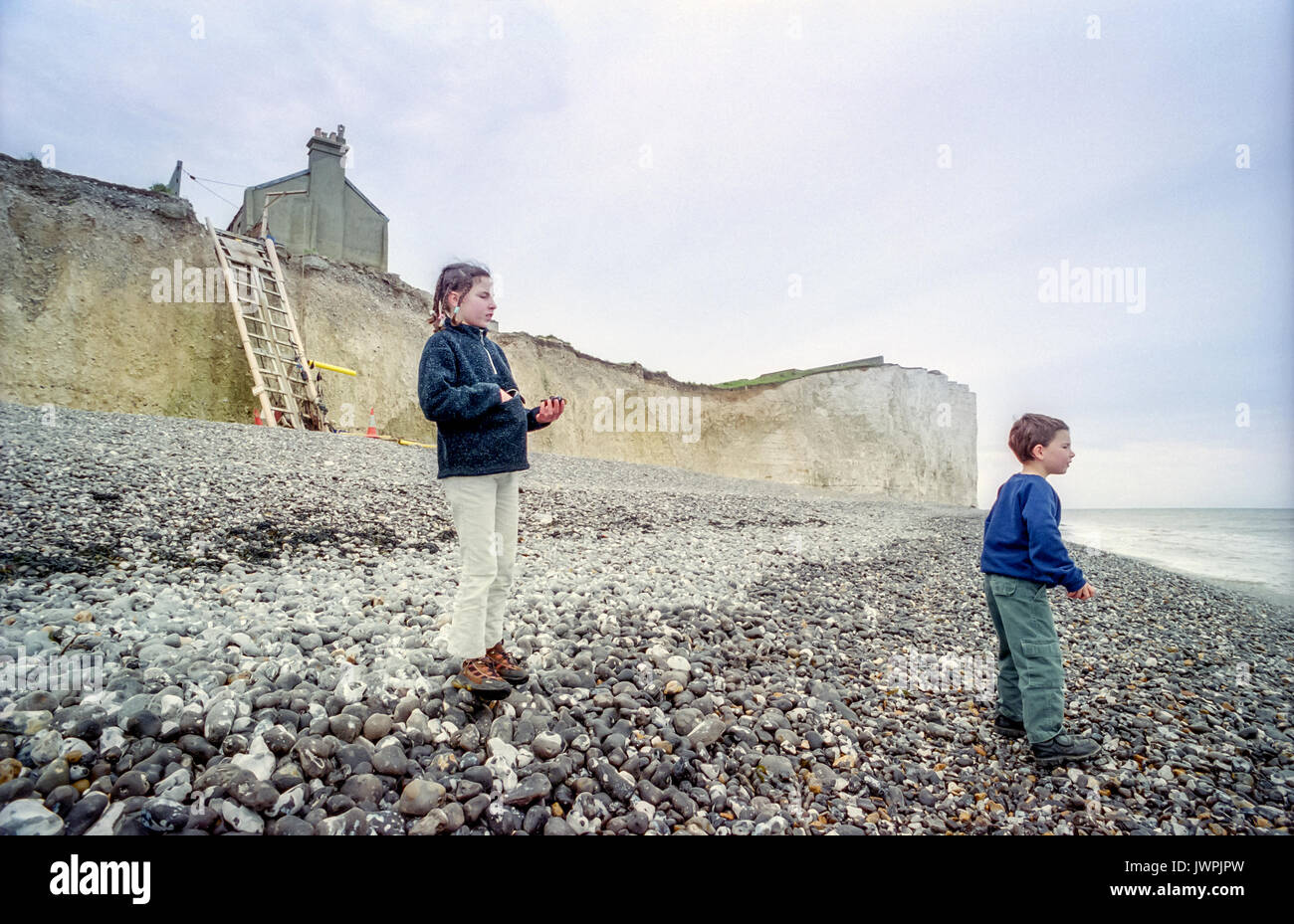 Children Playing On The Beach Below The Former Coastguard Cottages