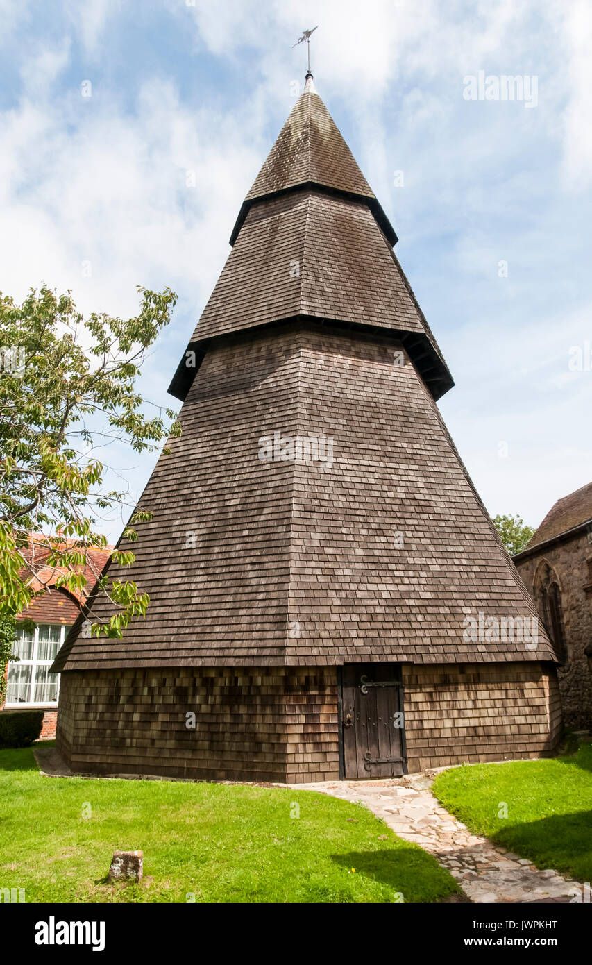 The octagonal wooden separate bell tower of St Augustine's church at Brookland on Romney Marsh. Stock Photo