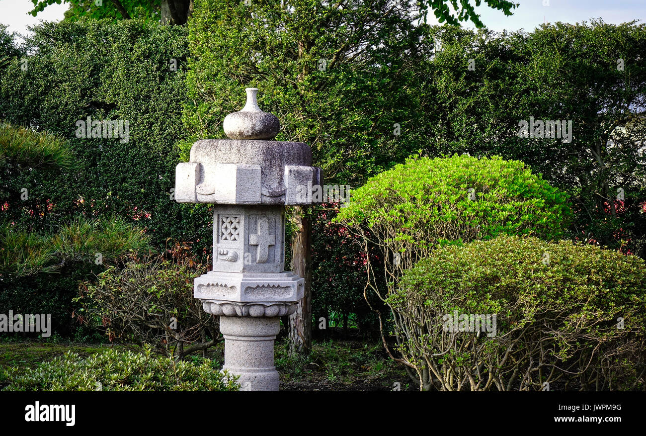 A stone lantern at the traditional garden in Kyoto, Japan Stock Photo ...