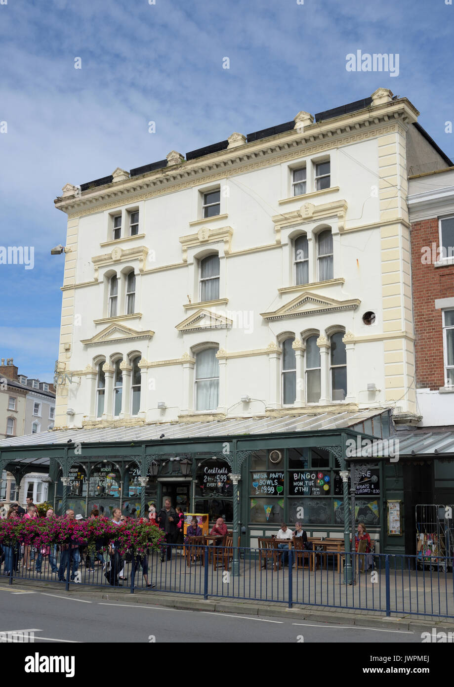 White rendered building with glass and iron verandah in llandudno north ...