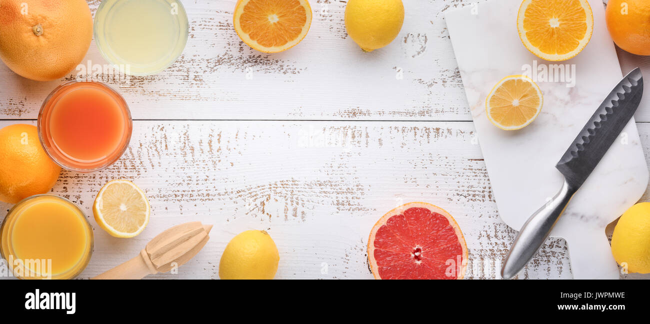 orange and lemon juice on table Stock Photo