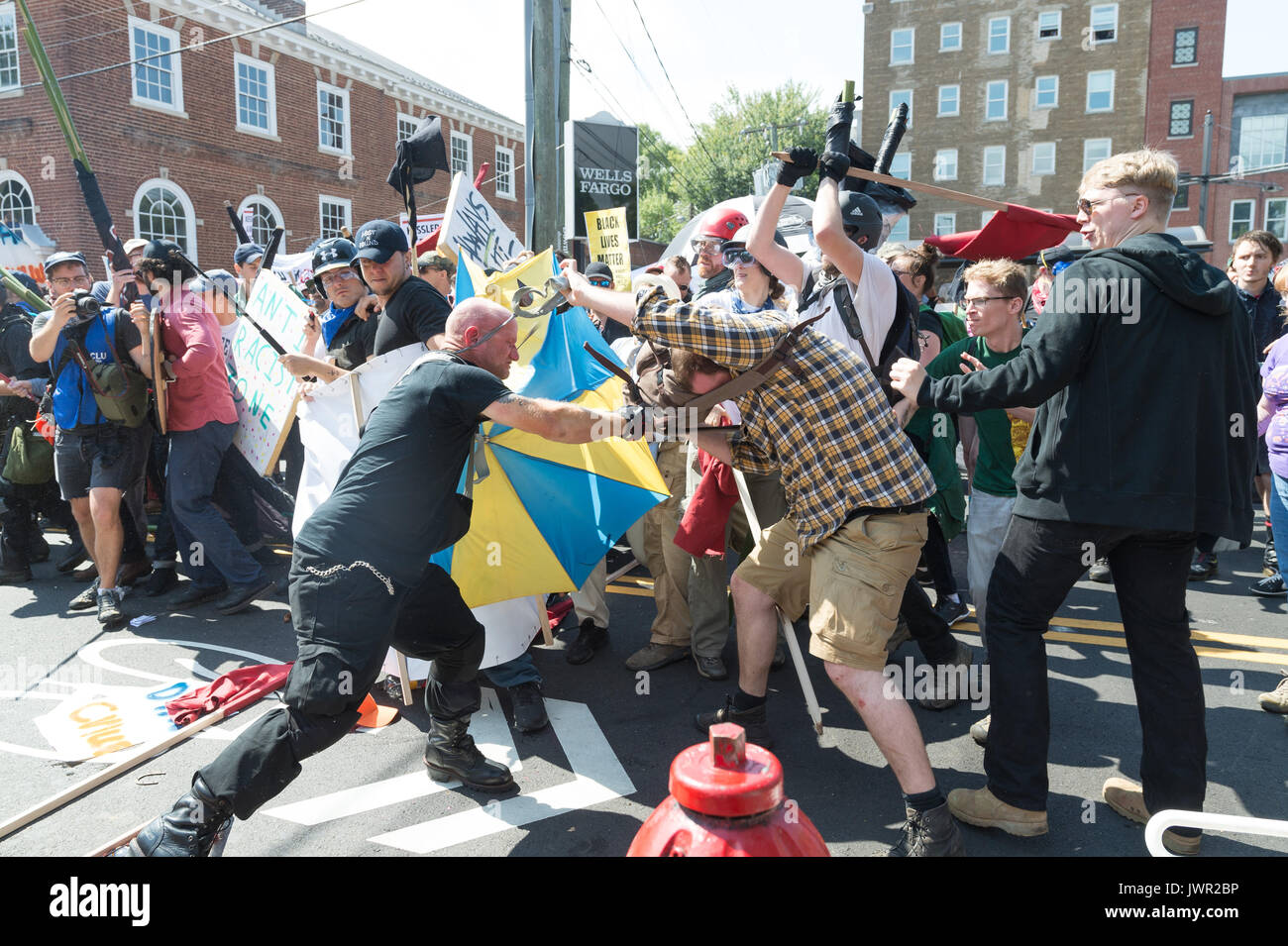Charlottesville, United States. 12th Aug, 2017. Neo-Nazis, white supremacists and other alt-right factions scuffled with counter-demonstrators near Emancipation Park (Formerly 'Lee Park') in downtown Charlottesville, Virginia. After fighting between factions escalated, Virginia State Police ordered the evacuation by all parties and cancellation of the 'Unite The Right' rally scheduled to take place in the park. Credit: Albin Lohr-Jones/Pacific Press/Alamy Live News Stock Photo