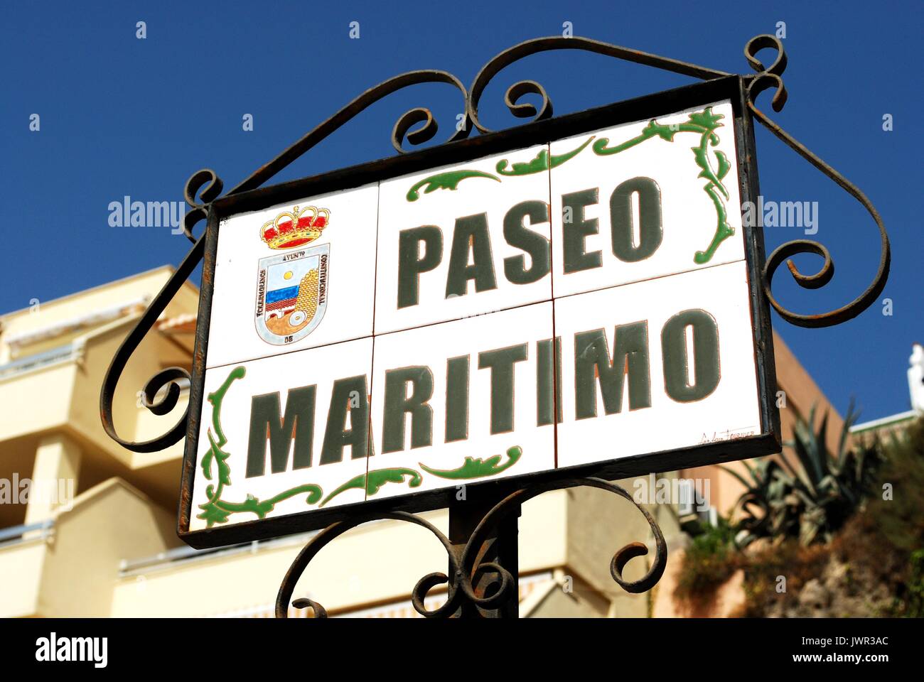 Ceramic Paseo Maritimo street sign in a wrought iron frame, Torremolinos, Malaga Province, Andalusia, Spain, Western Europe. Stock Photo