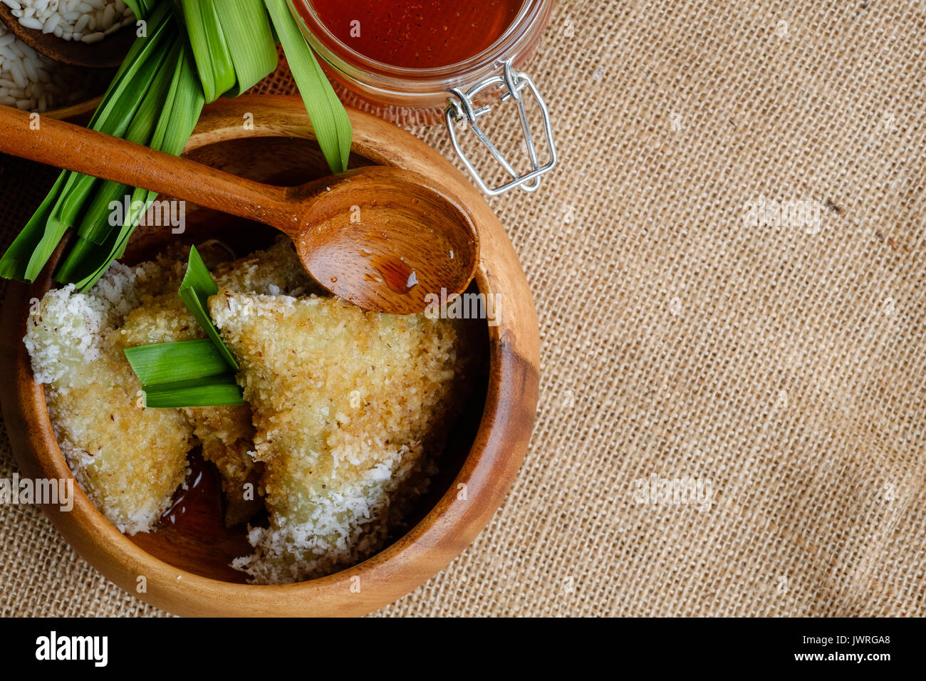 Lupis cake or Kue Lupis from Indonesia in wooden bowl Stock Photo
