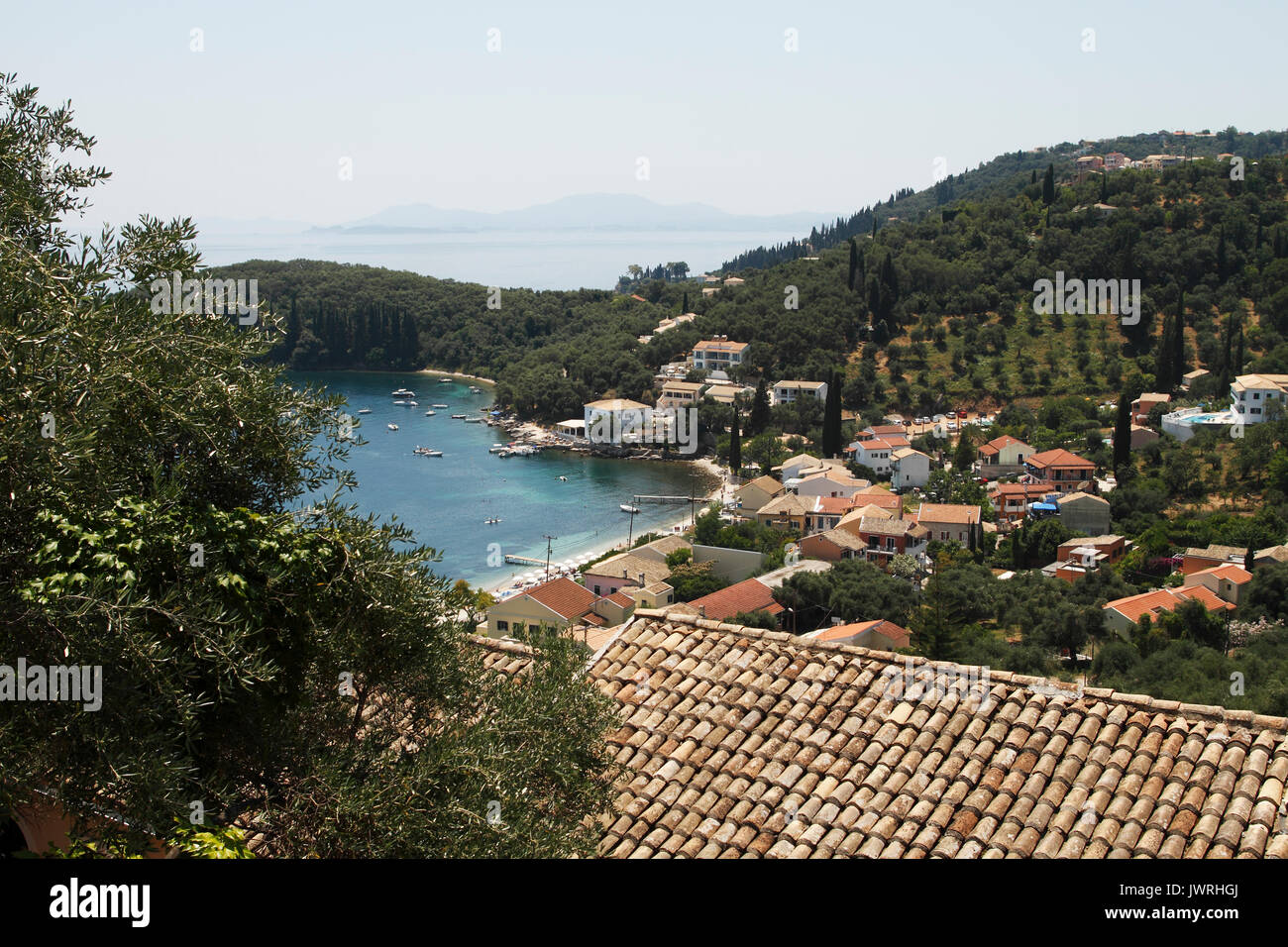Kelami, viewed from the hillside. Centre - The Durrells 'White House, Kalami, Corfu 'A white house set like a dice on a rock already venerable with th Stock Photo