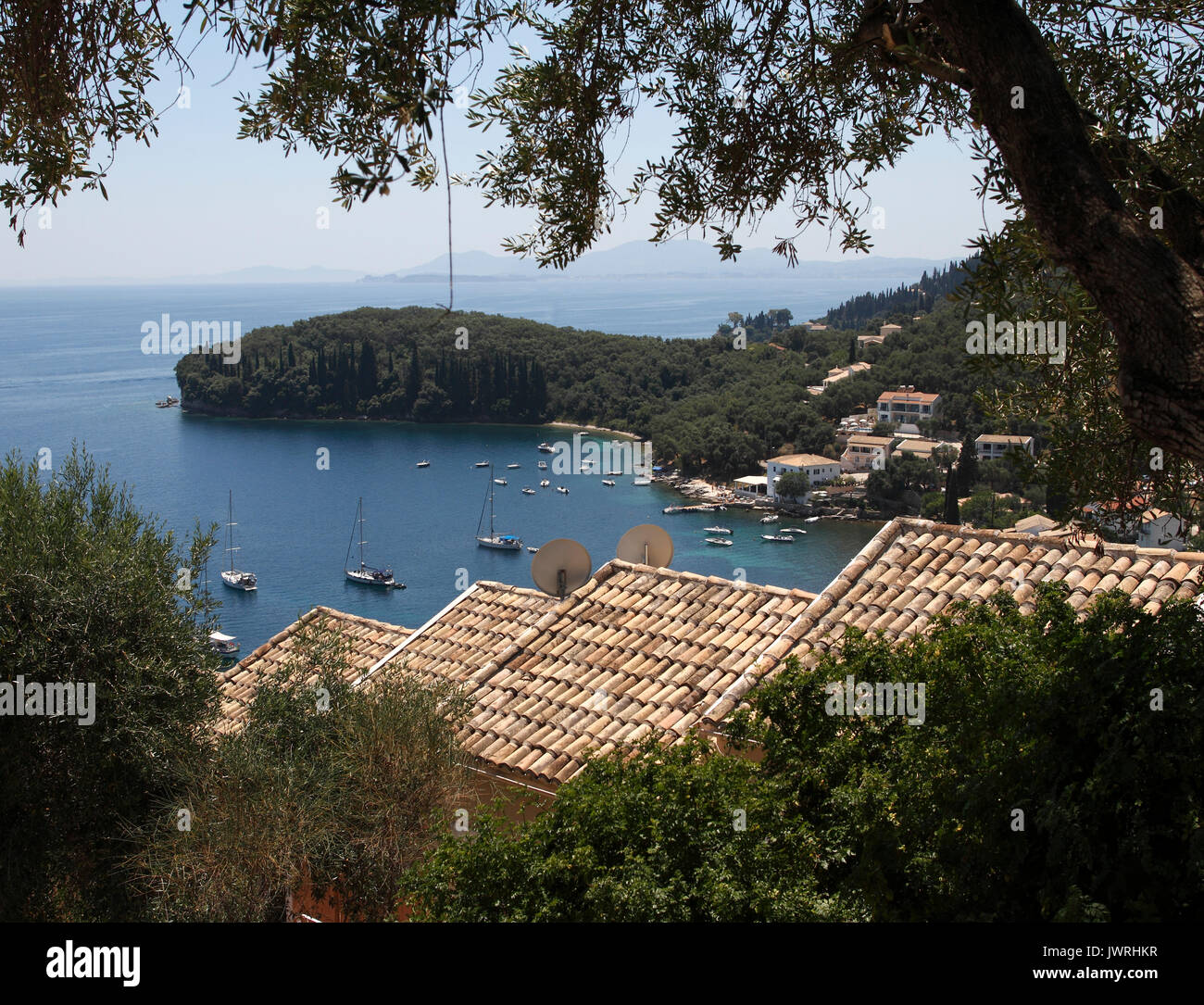 Kelami, viewed from the hillside. Centre - The Durrells 'White House, Kalami, Corfu 'A white house set like a dice on a rock already venerable with th Stock Photo