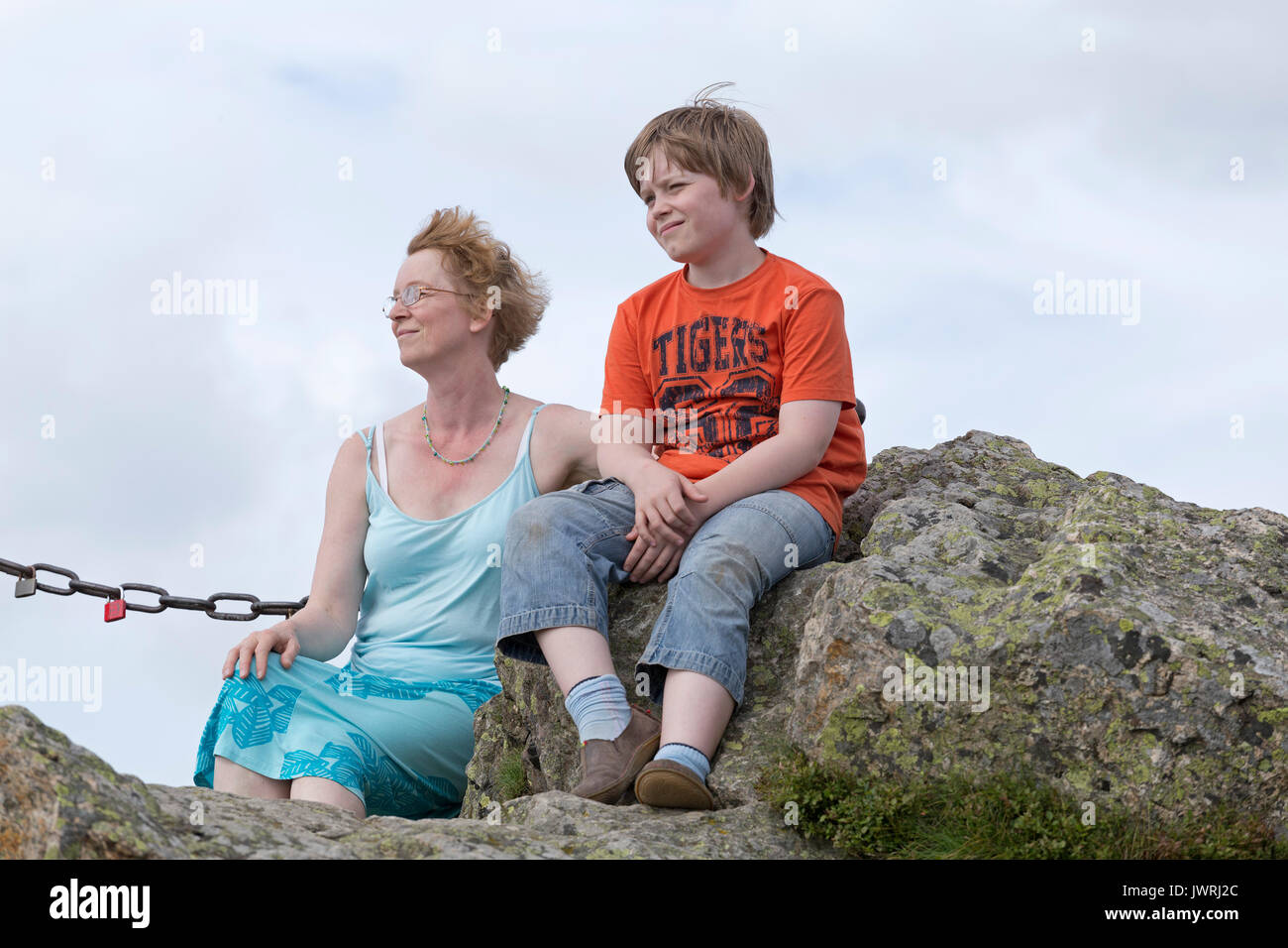 mother and son on the summit of Feldstein, Bruchhausen Rocks, Sauerland, Northrhine-Westfalia, Germany Stock Photo