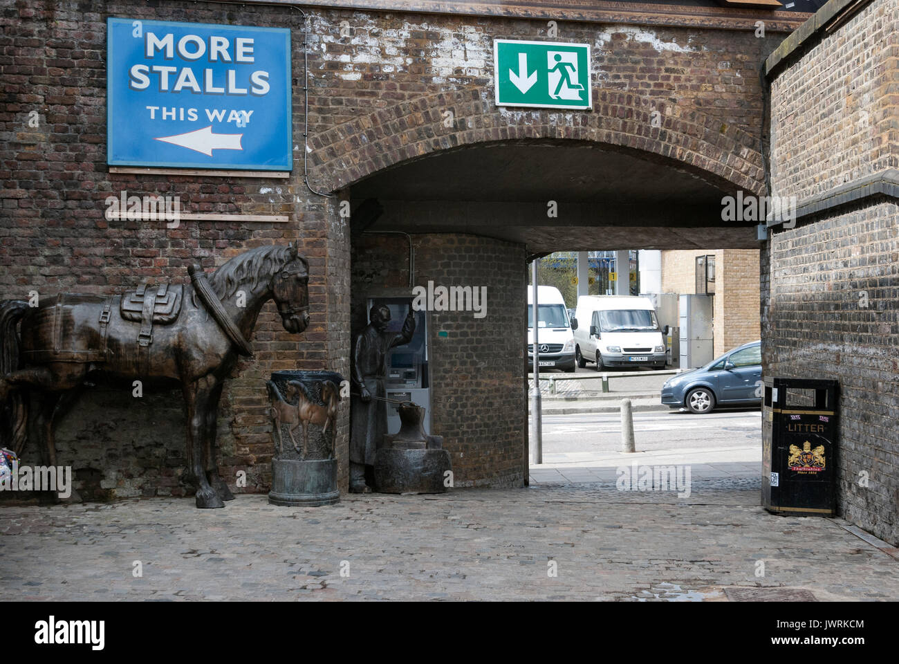 London England, Camden Market, Horse Shoe Maker Statue, Horse Statue, Bridge and Underpass, Brick Walls, Stalls Sign, Camden Town, Camden Stables Stock Photo