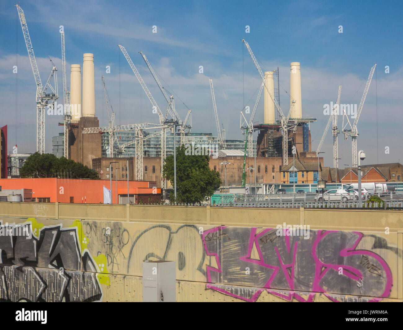 An unusual view of Battersea Power Station with a foreground of urban graffiti Stock Photo